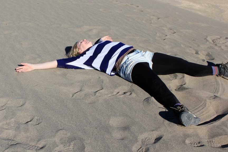 Brandy Little making a sand angel in Death Valley. Photo by Barbara Little.