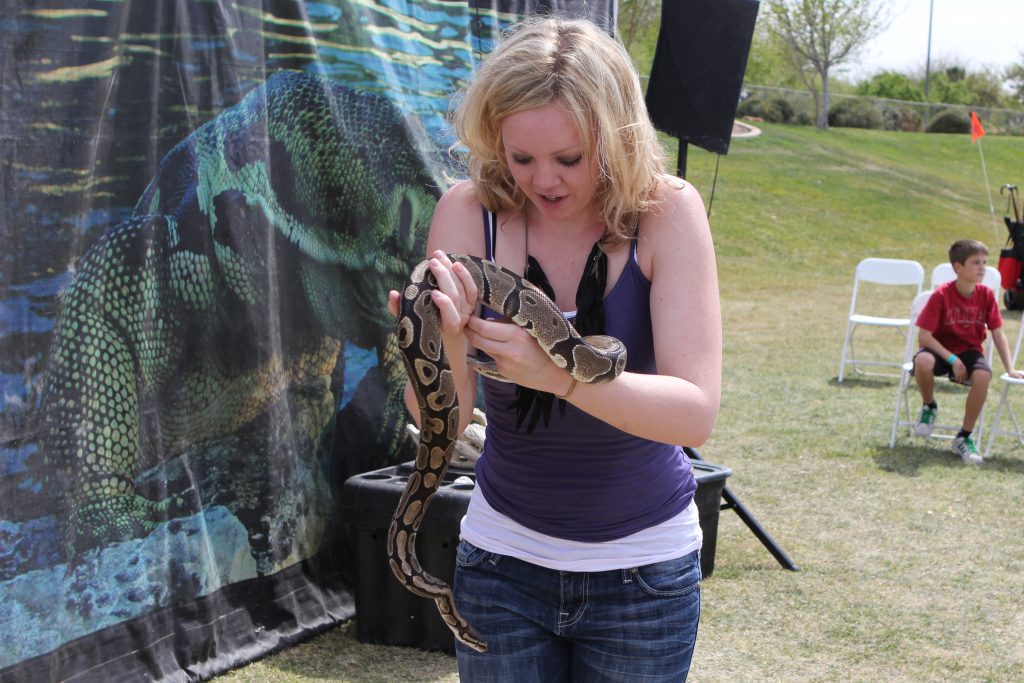 Brandy and a snake at the Ostrich Festival photo by Jake Williams